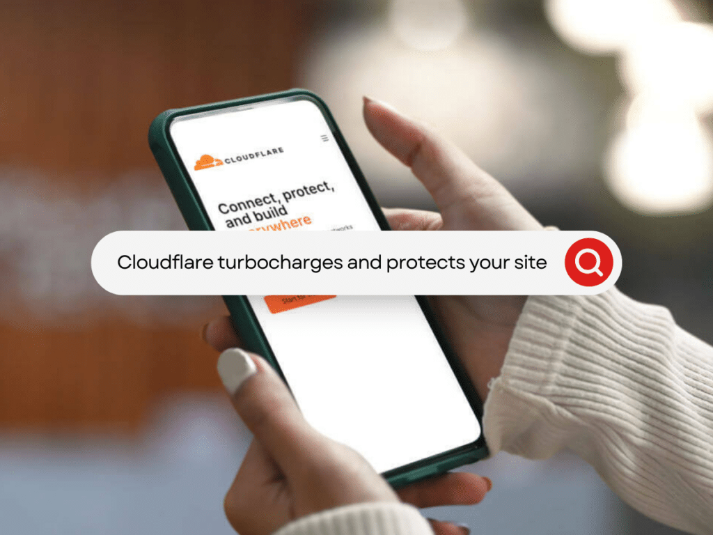 A person holding a phone displaying the Cloudflare website