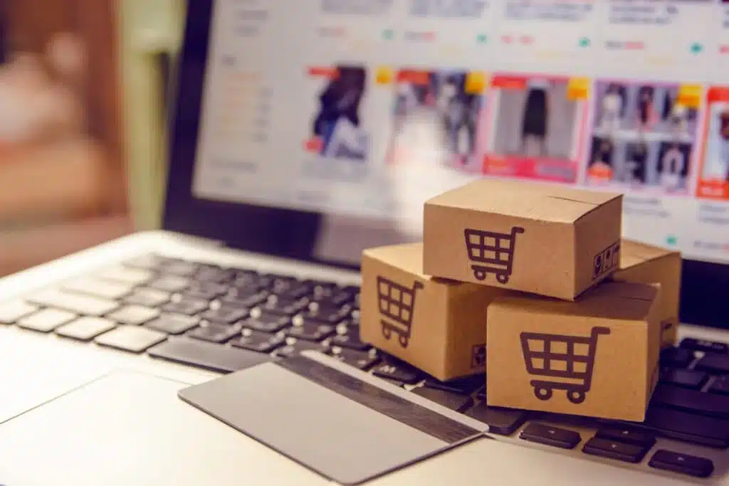 E-commerce shopping with boxes on a laptop keyboard_jpeg