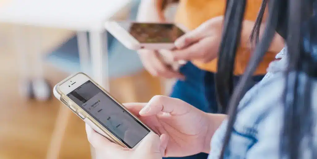  People using smartphones for communication or browsing, highlighting the modern digital lifestyle