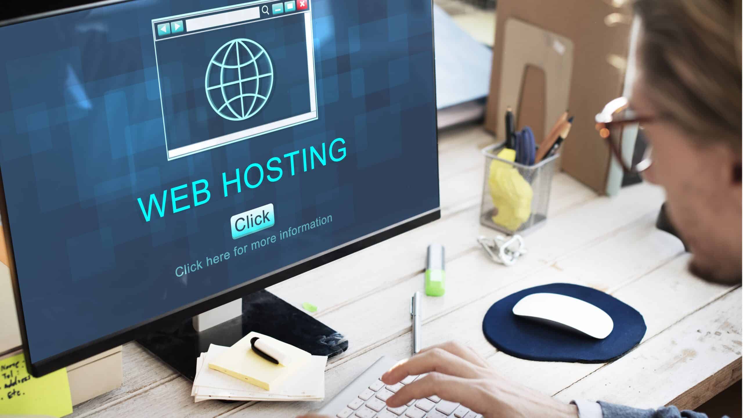 view of a man using PC with web hosting written on it