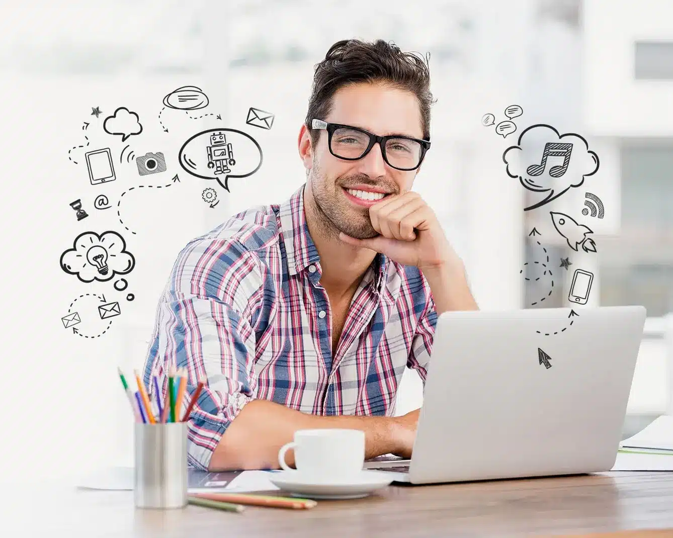 A person smiling while working on a laptop with various digital icons floating around.