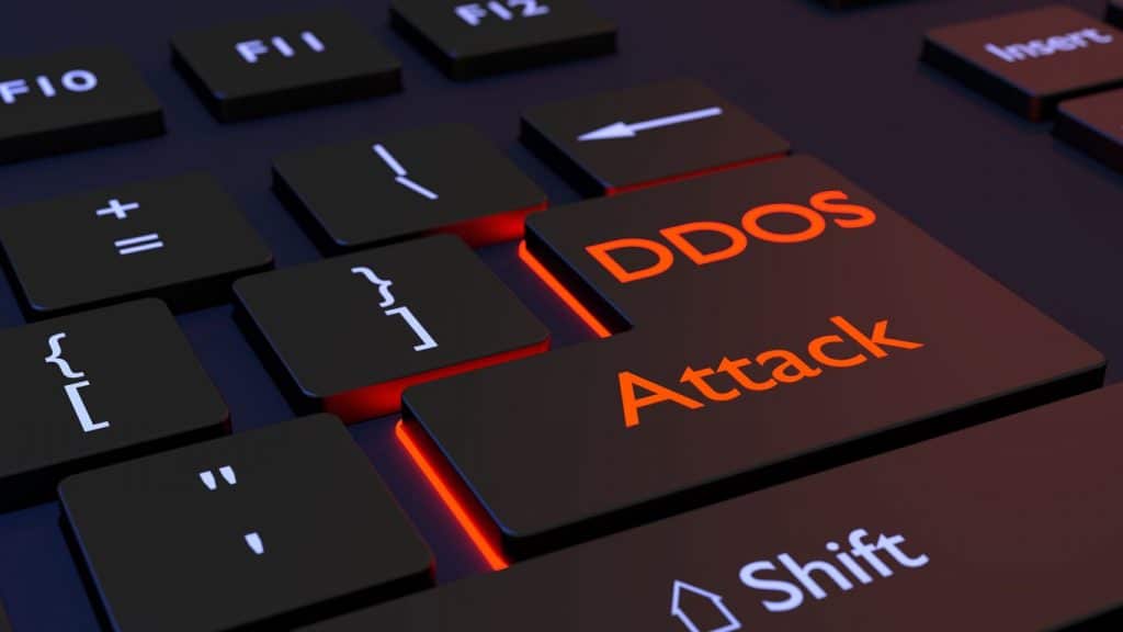 Keyboard close-up highlighting a key labeled ‘DDoS Attack.
